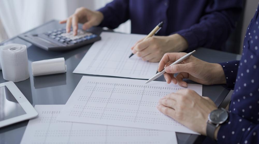 Bookkeeper organizing financial records and transactions for an Anchorage small business