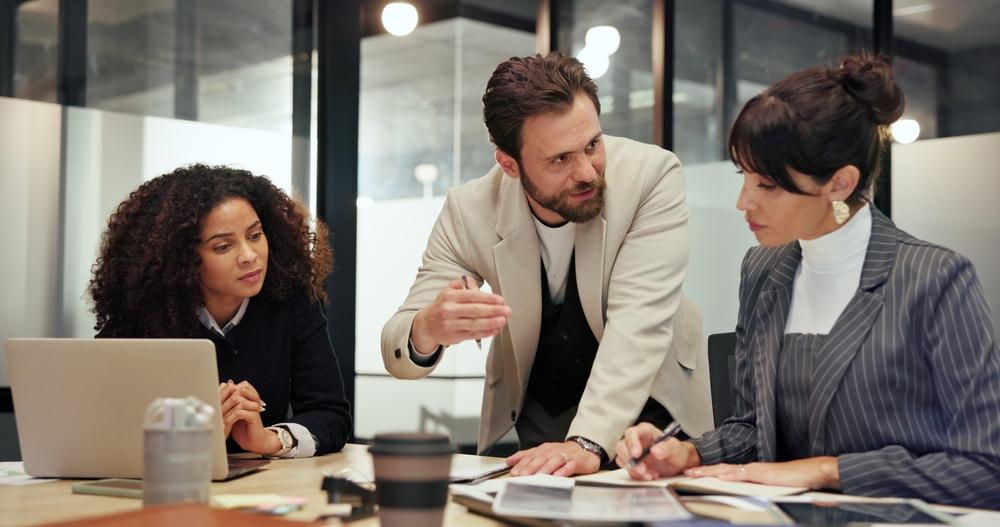 Anchorage business consultant reviewing financial reports and planning numbers with a small business owner